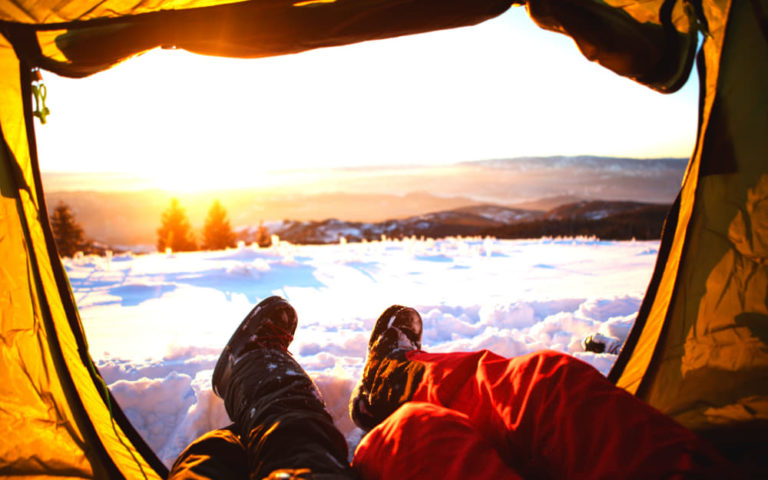 Insulating A Tent For Winter Camping © Image Courtesy of M_a_y_a from Getty Images Signature by Canva