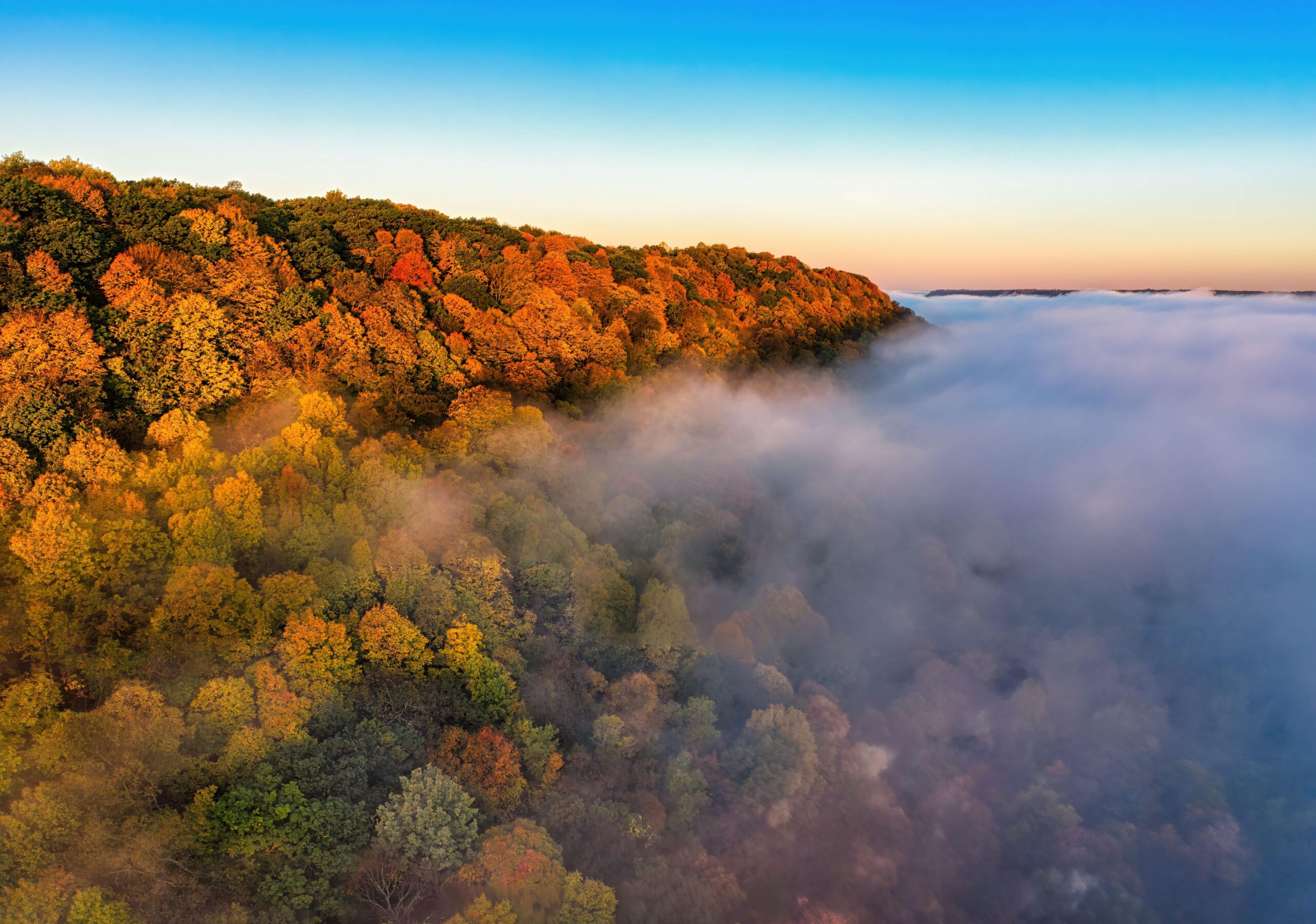 Stunning aerial view of colorful autumn forest and mist in Wacouta, Minnesota - Best National Parks for fall colors