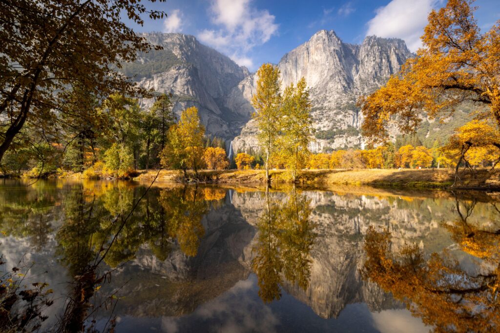 Stunning autumn view with fall foliage reflecting in the river at Yosemite National Park