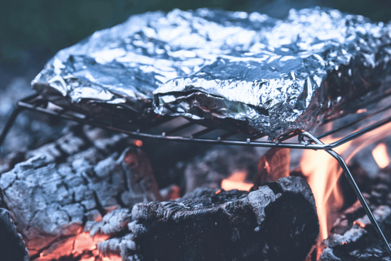 Foil packet camping meals cooking over a campfire